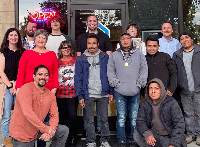 Company staff posing for a photo together